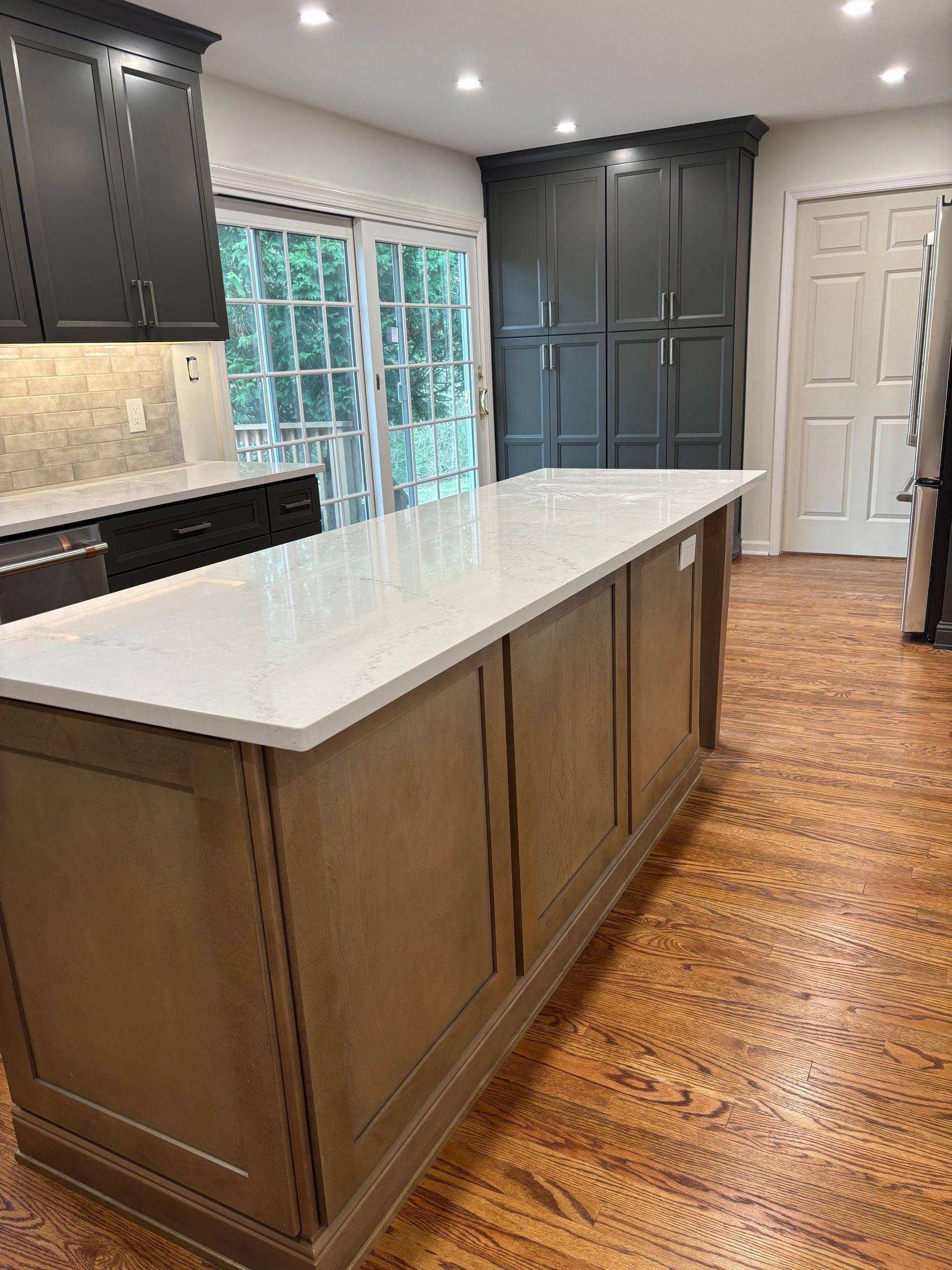 There is a large island in the middle of the kitchen.