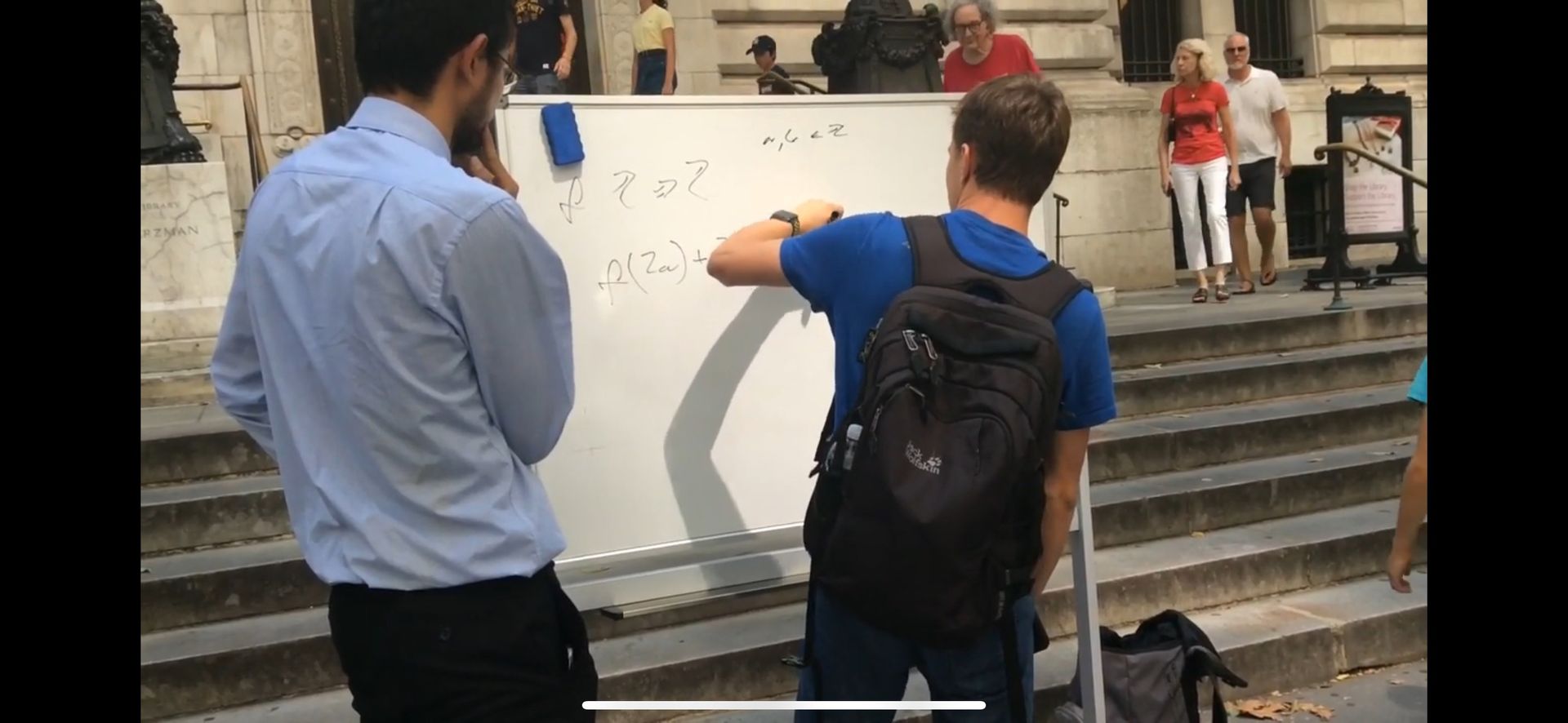 Two Men Standing in Front of a Whiteboard — Miami, FL — Marin Maths Tutors