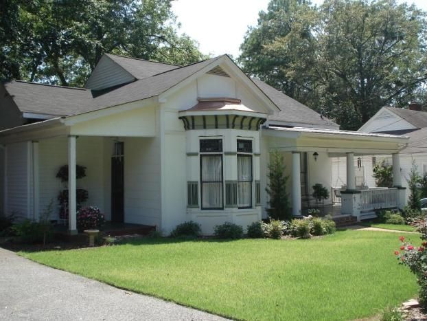 A white house with a large bay window