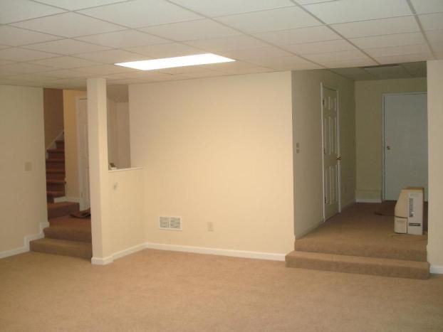 An empty room with a box on the floor