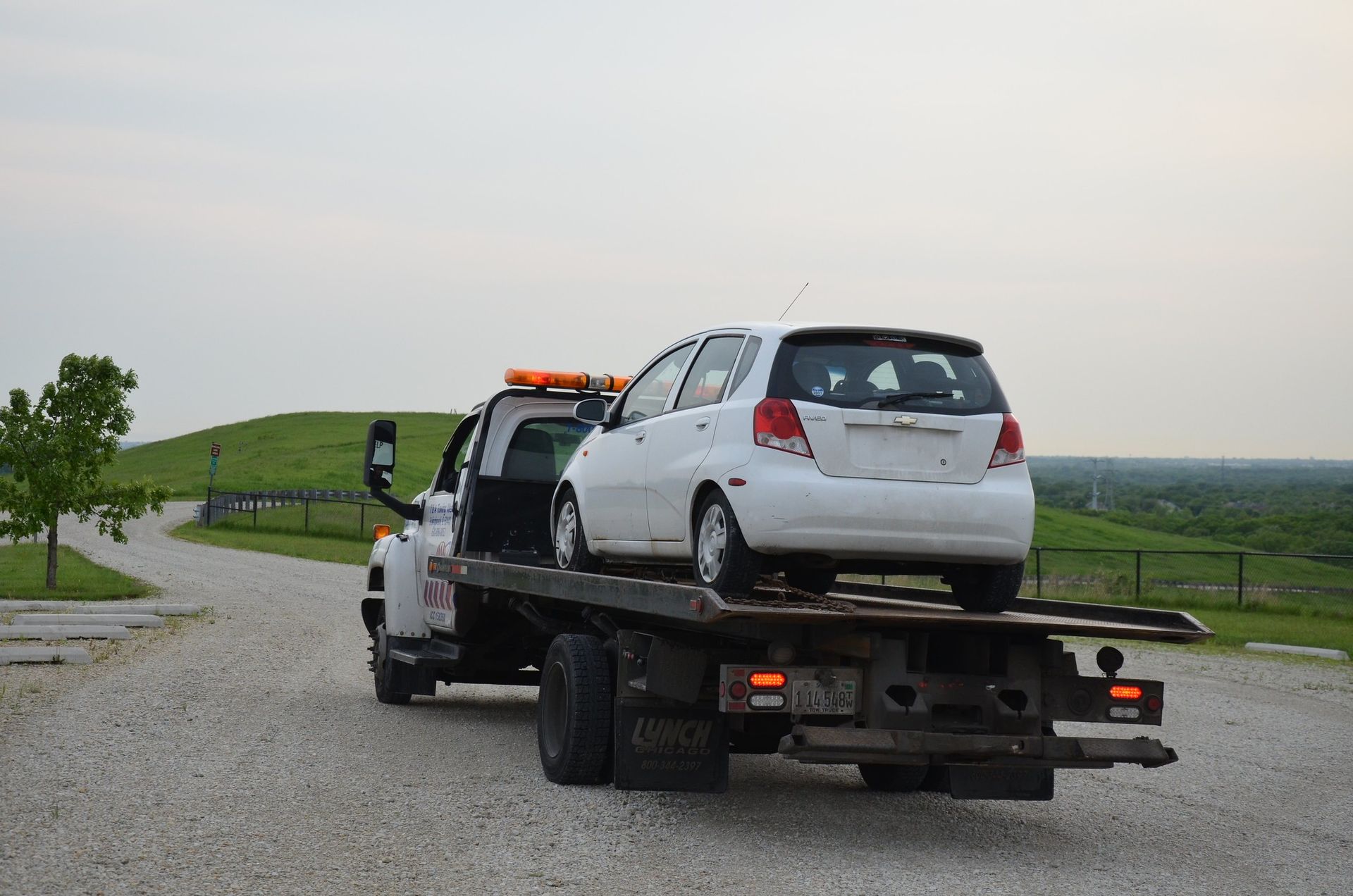 Car loaded on flatbed and ready for transport