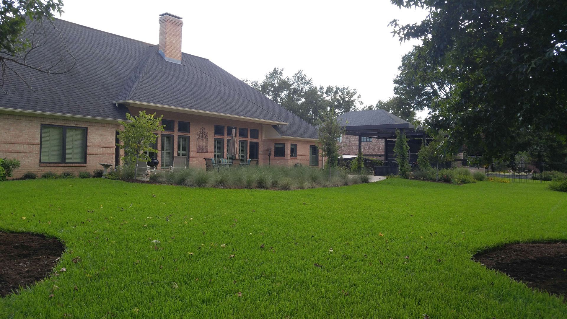 A large house with a large lawn in front of it