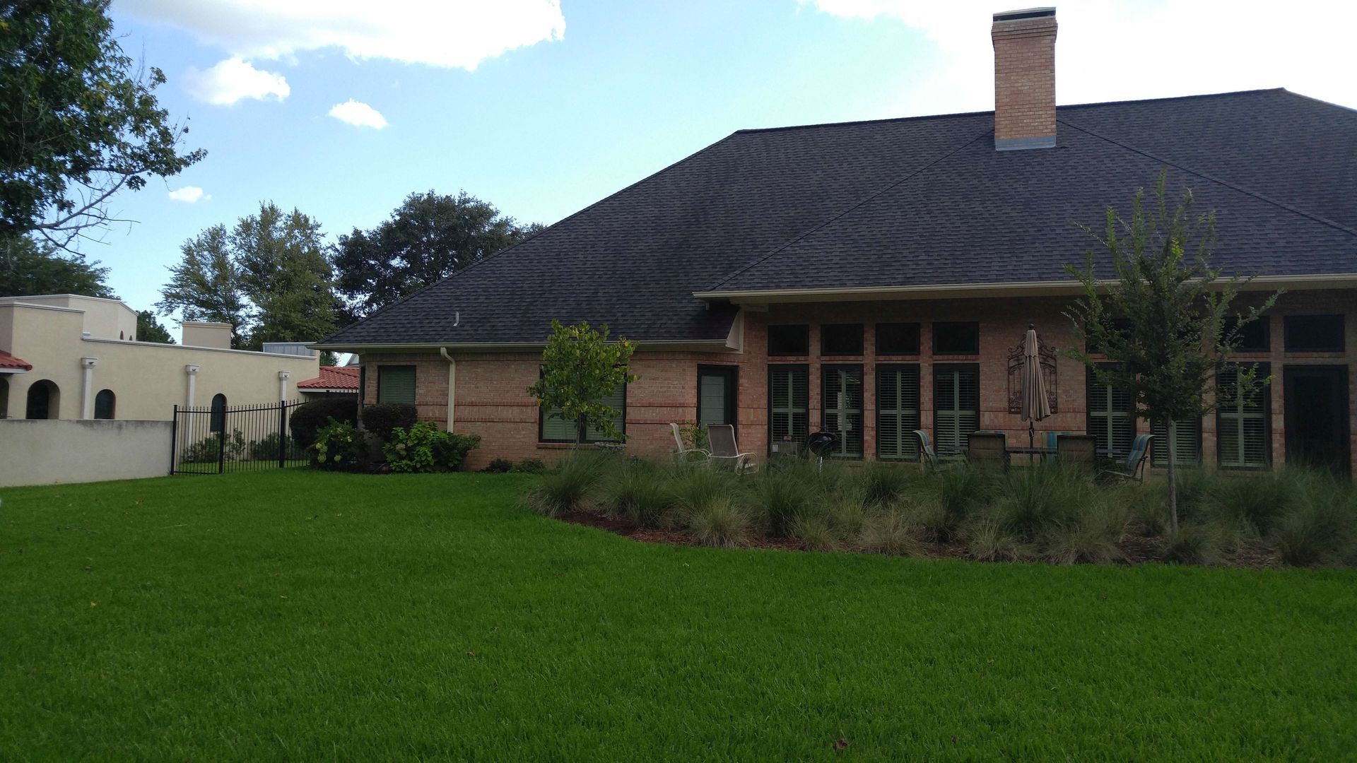 A large house with a large lawn in front of it