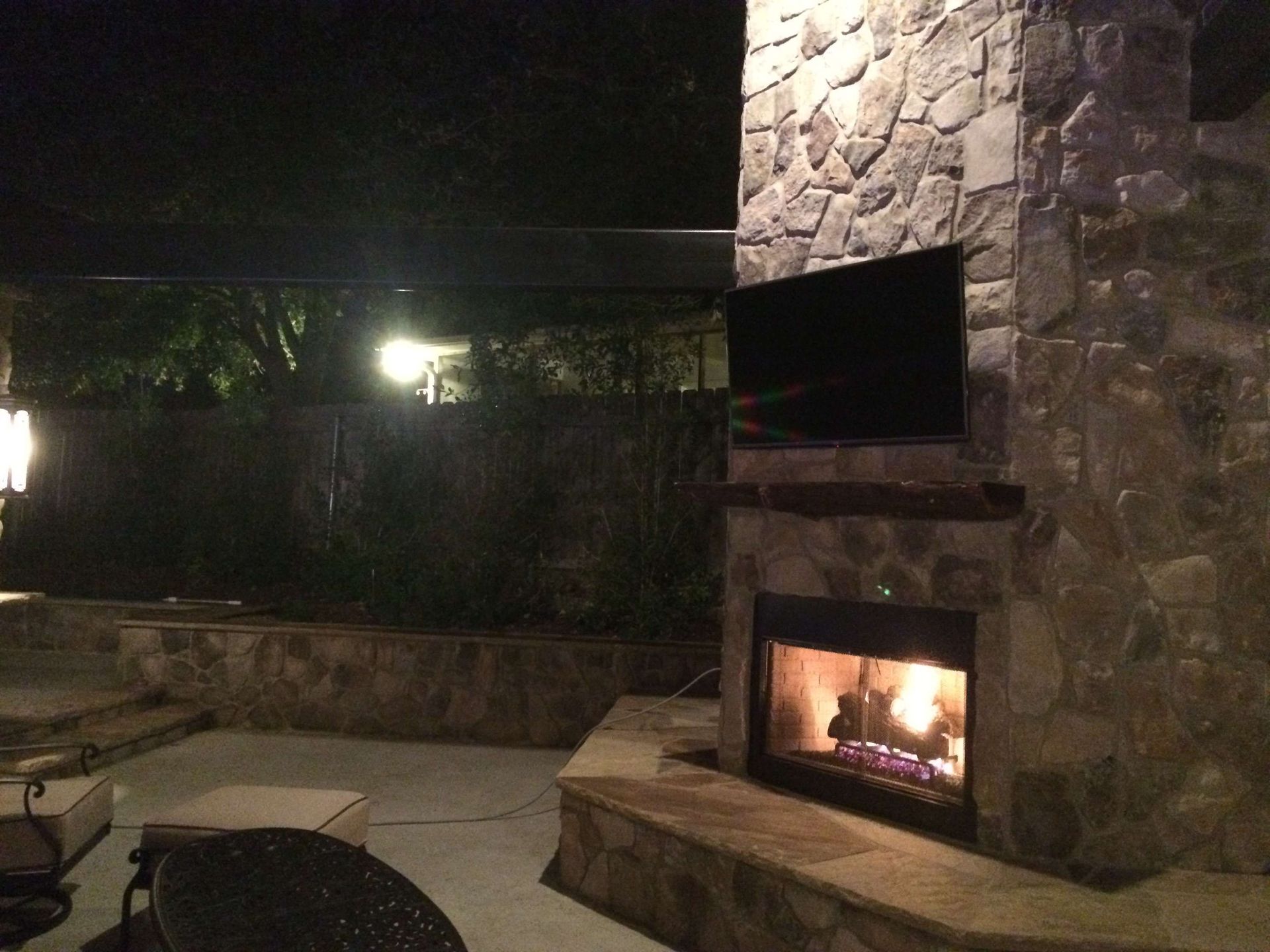 A fireplace with a flat screen tv mounted on it