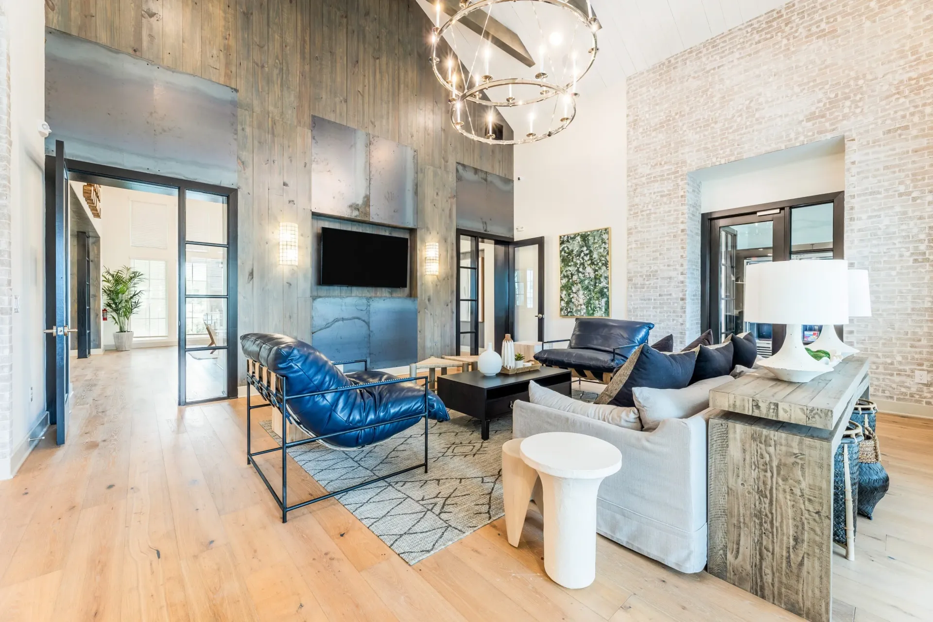 Luxury living room with comfortable seating, fireplace, and TV.