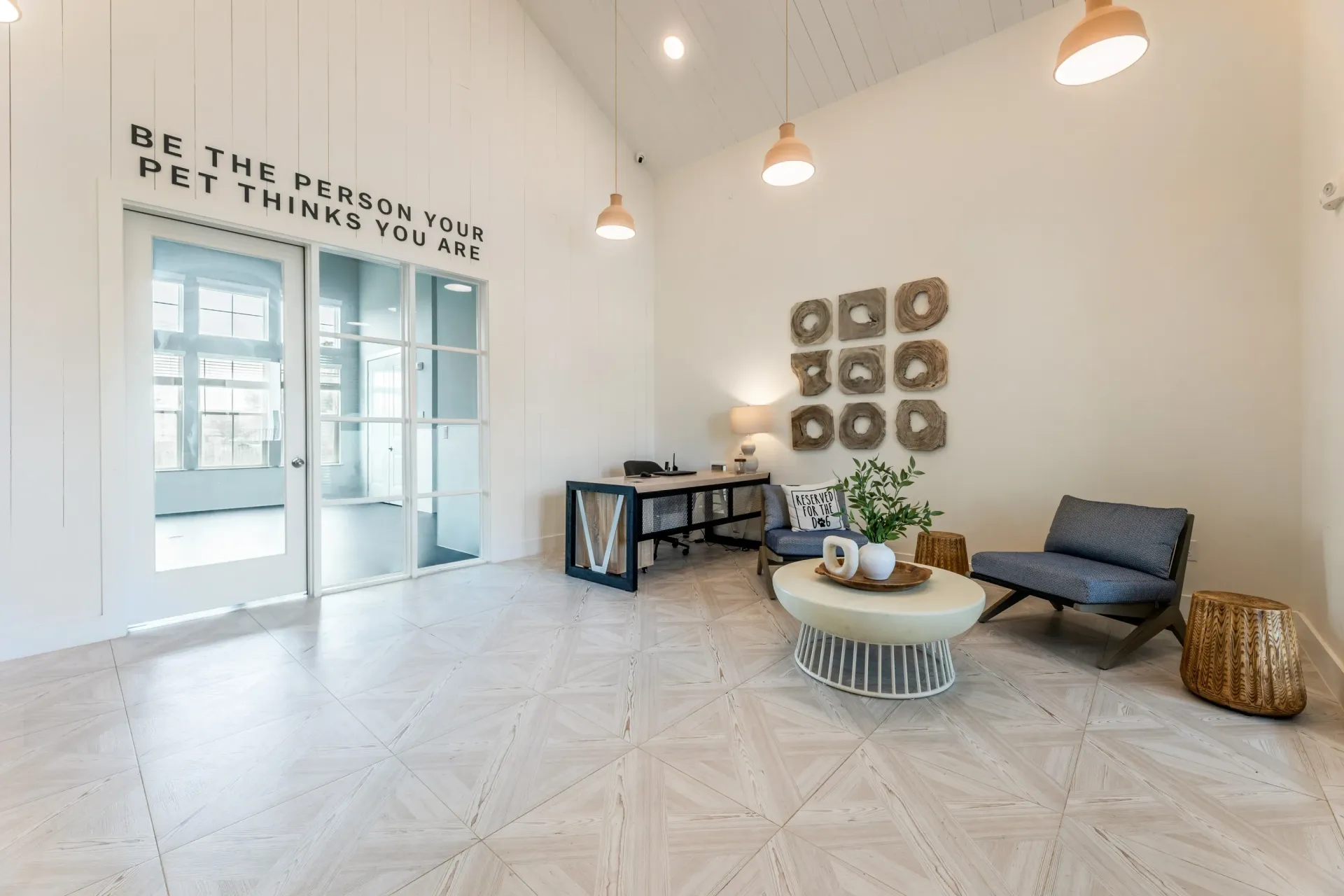 Lobby with reception desk, seating area, and a door with