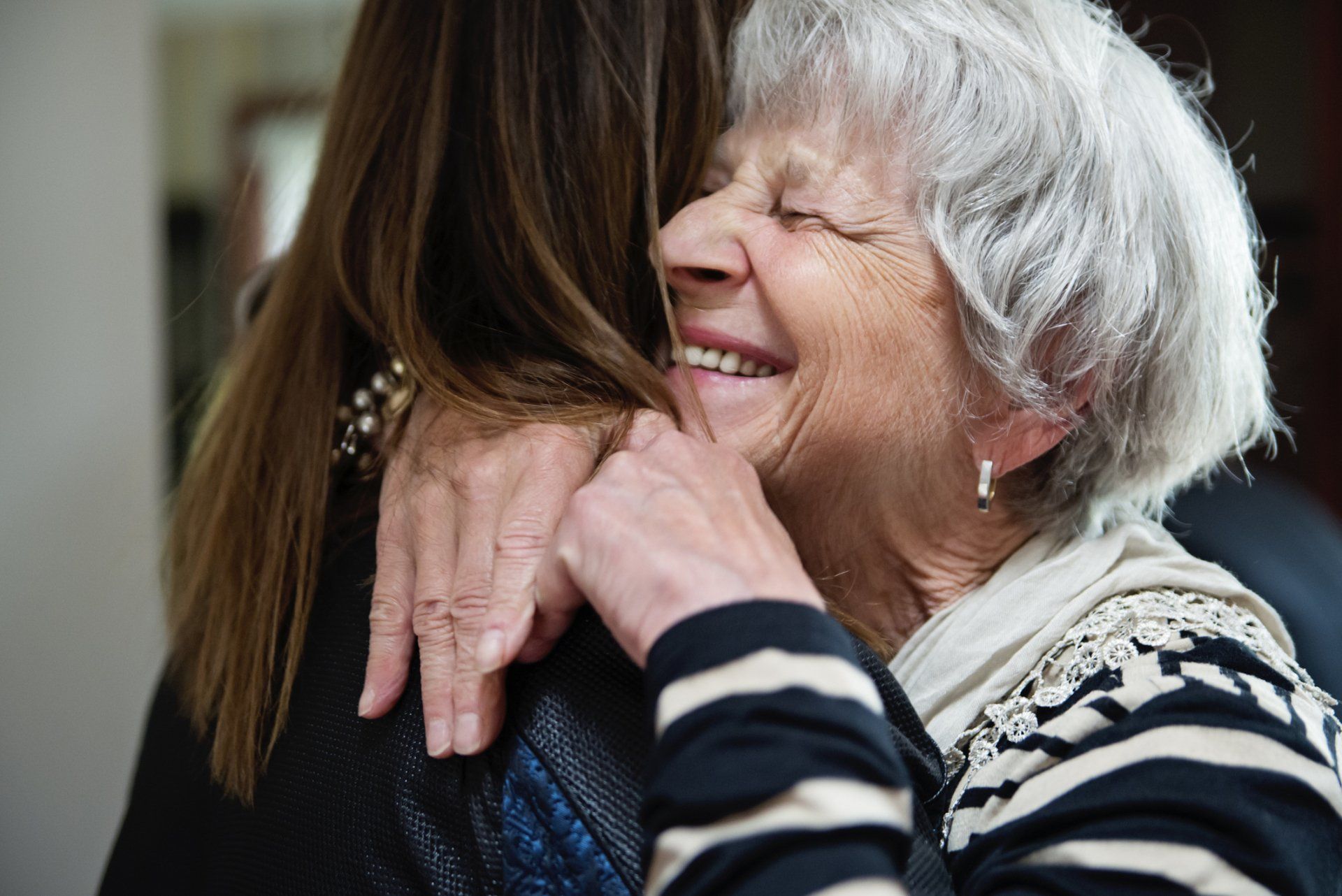 Old Lady Hugging A Younger Lady — Deerfield Beach, FL — Blade & Blade P.A.