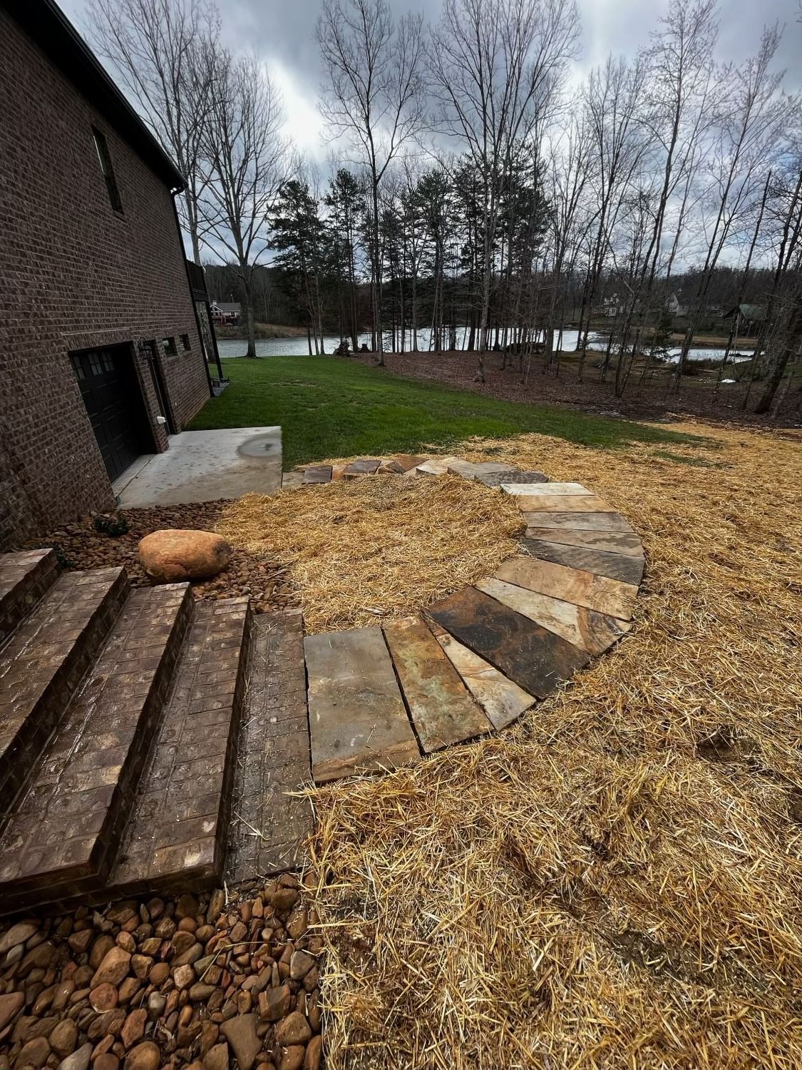 There is a circular walkway in the middle of the yard.