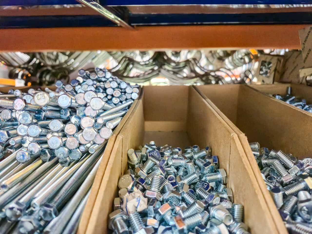 Cardboard boxes filled with assorted aluminum cans in a recycling or sorting facility