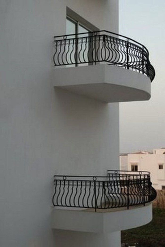 a building with three balconies on the side of it