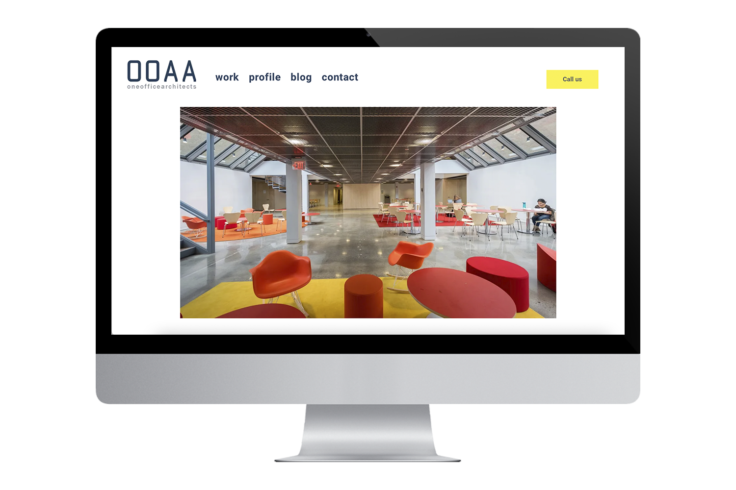 a computer monitor displays a website for one office architecture