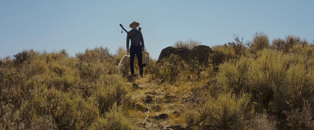 Damsel - Robert Pattinson on the trail with butterscotch.