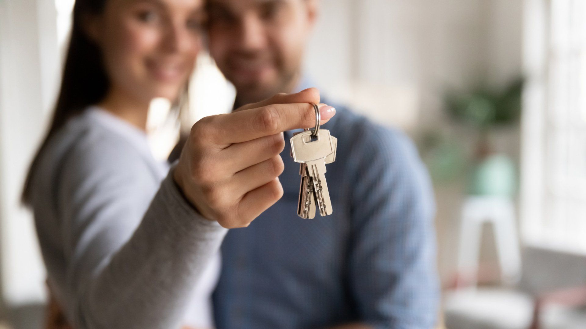 couple with keys to home