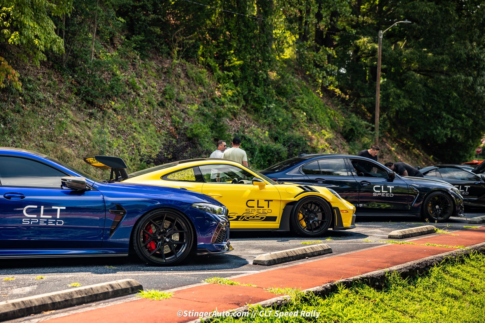 A row of cars with CLT Speed decals