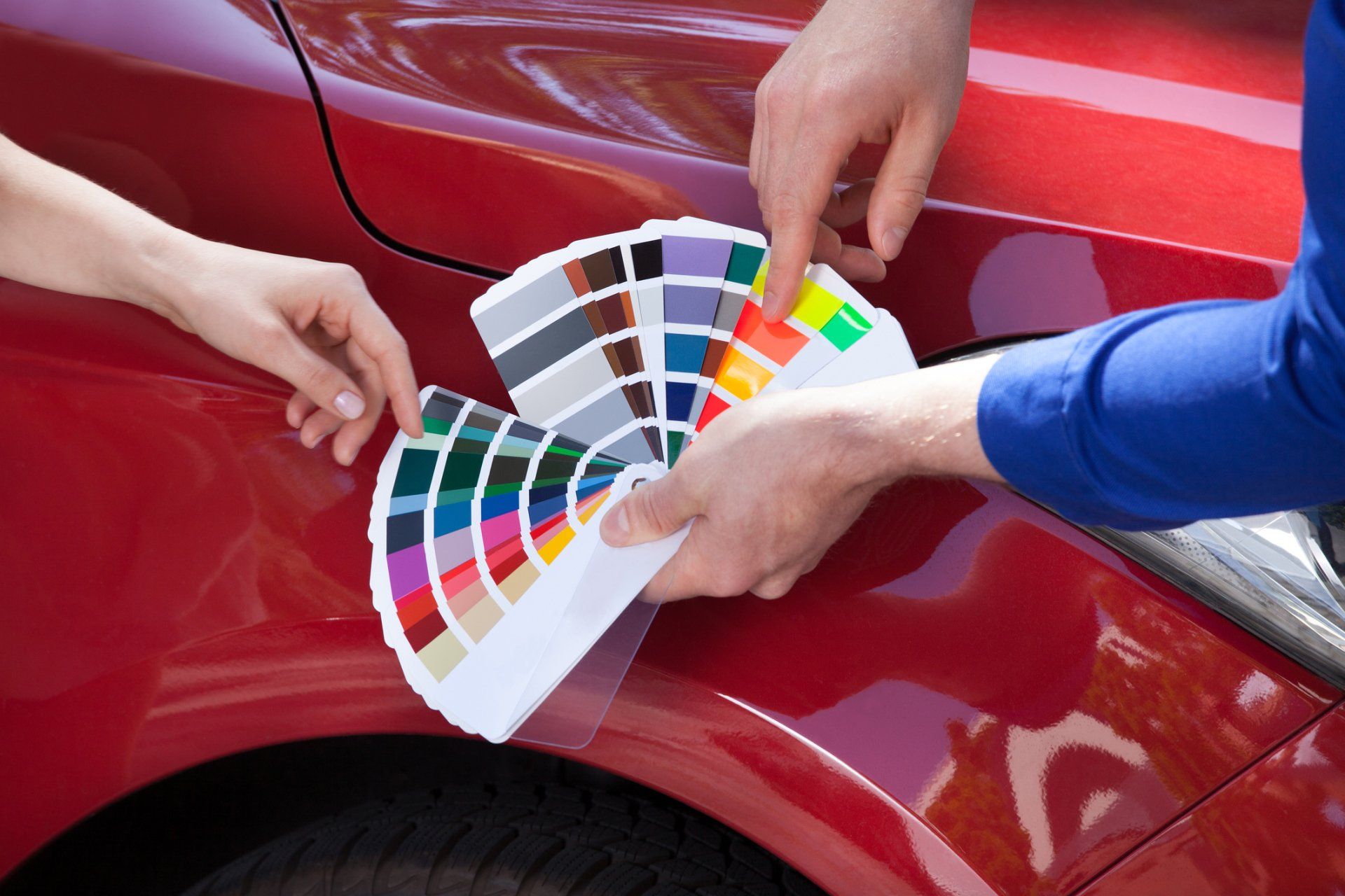Repaint — Spray Gun With Red Paint Painting a Car in Missoula, MT