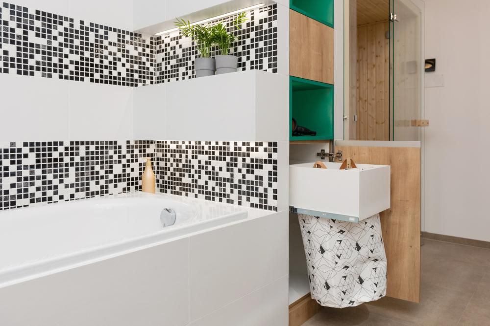 A Bathroom with A Sink , Bathtub and Mirror — Peninsula Tiles in Umina Beach, NSW
