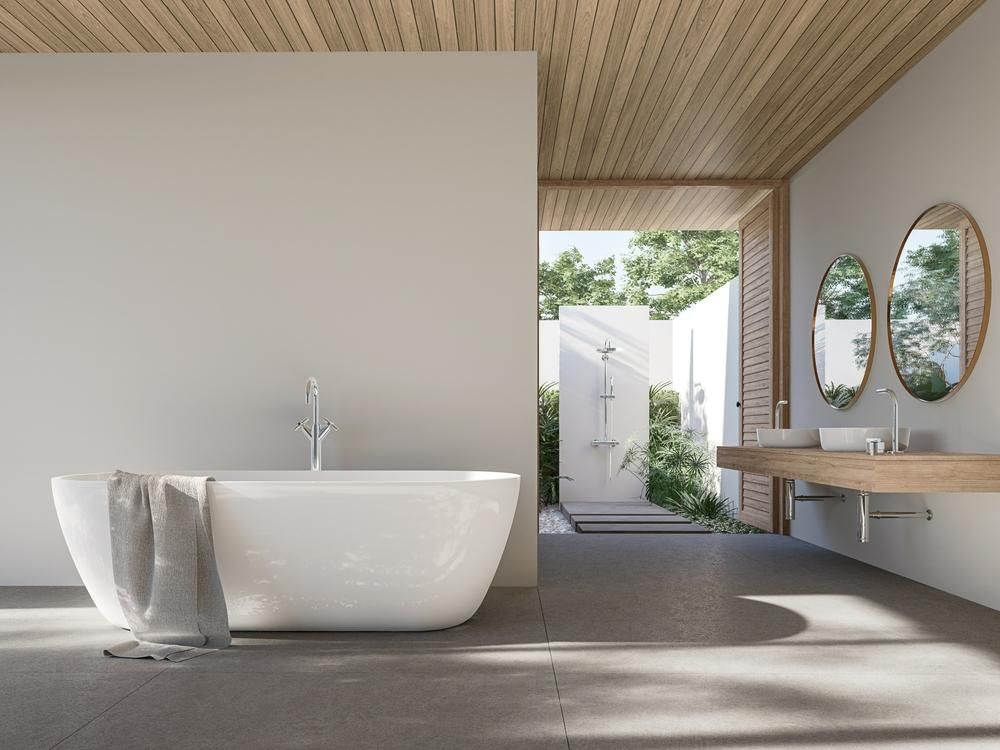 A Bathroom with A Bathtub, Sink and Mirrors — Peninsula Tiles in Umina Beach, NSW