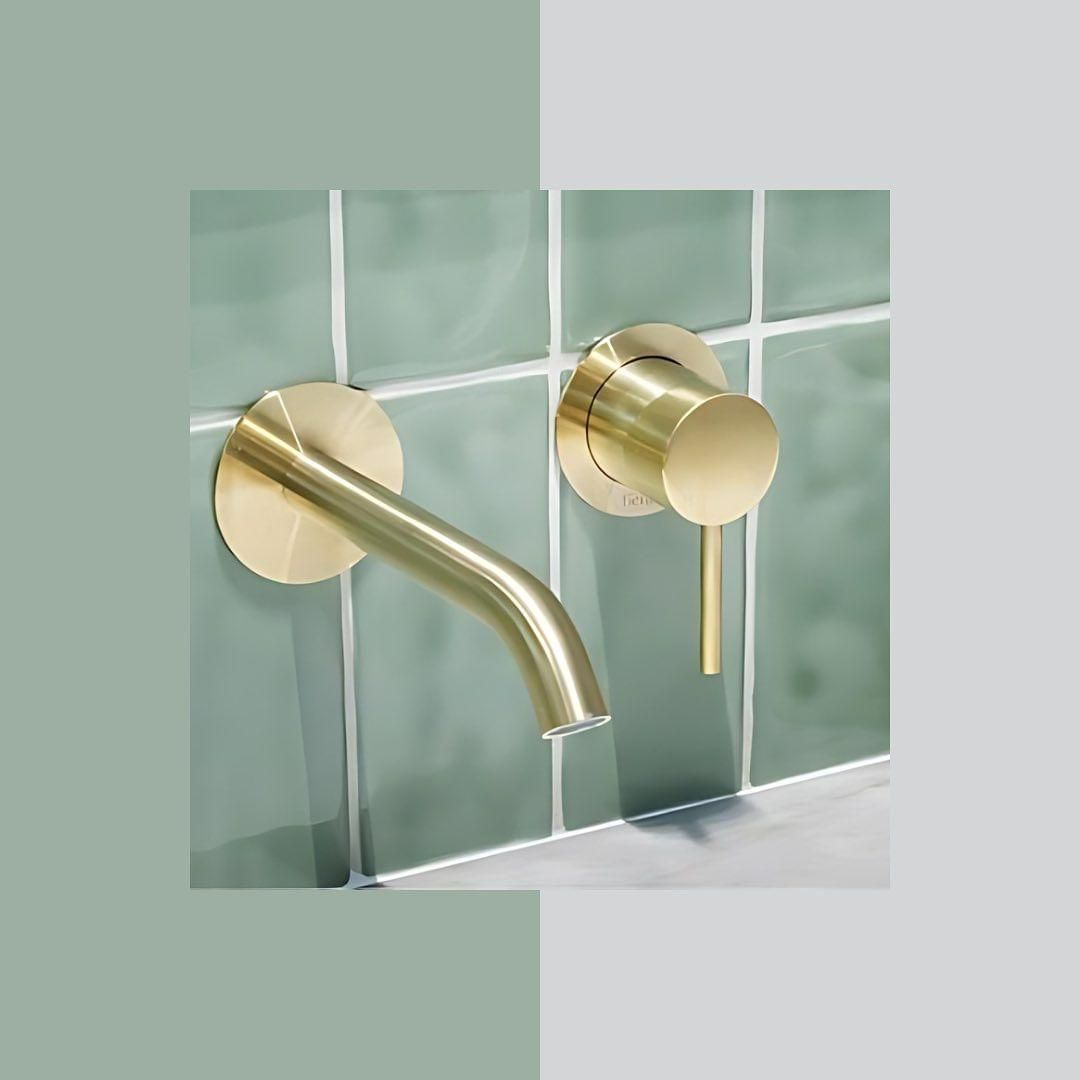 A Bathroom Sink with A Brass Faucet on The Wall — Peninsula Tiles in Umina Beach, NSW