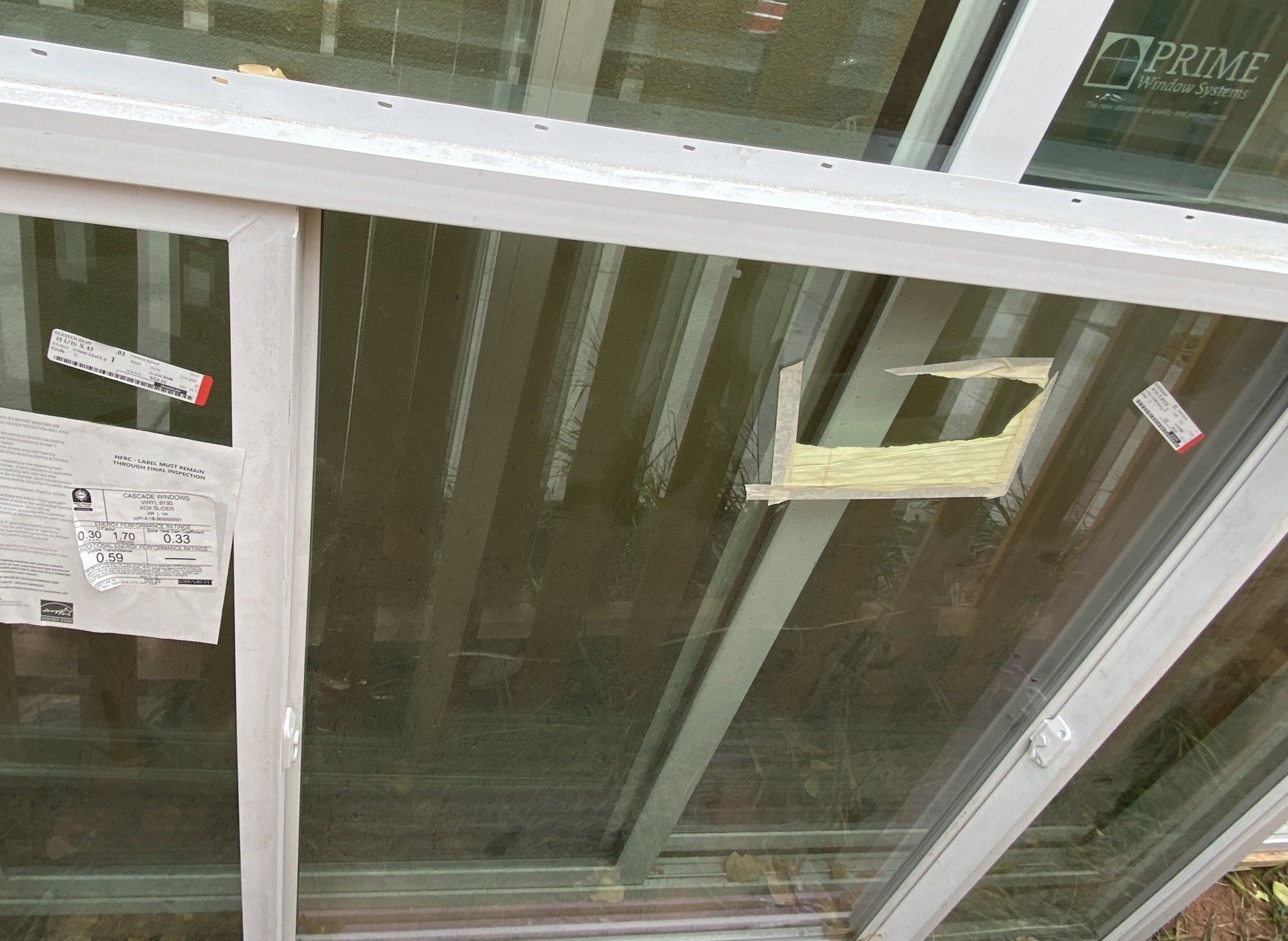 A sliding glass door with the word prime on it