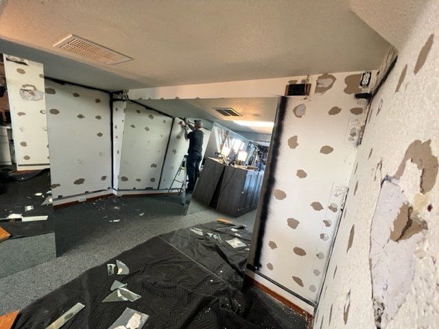 A room with a lot of mirrors on the wall