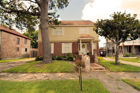 Two story house with pine tree in front yard