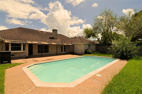 Pool in backyard of house