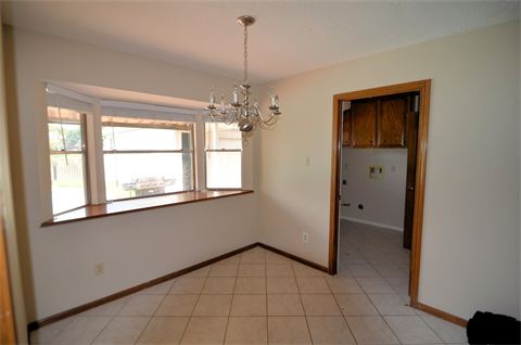 Room with tiled floor and finished wood trim