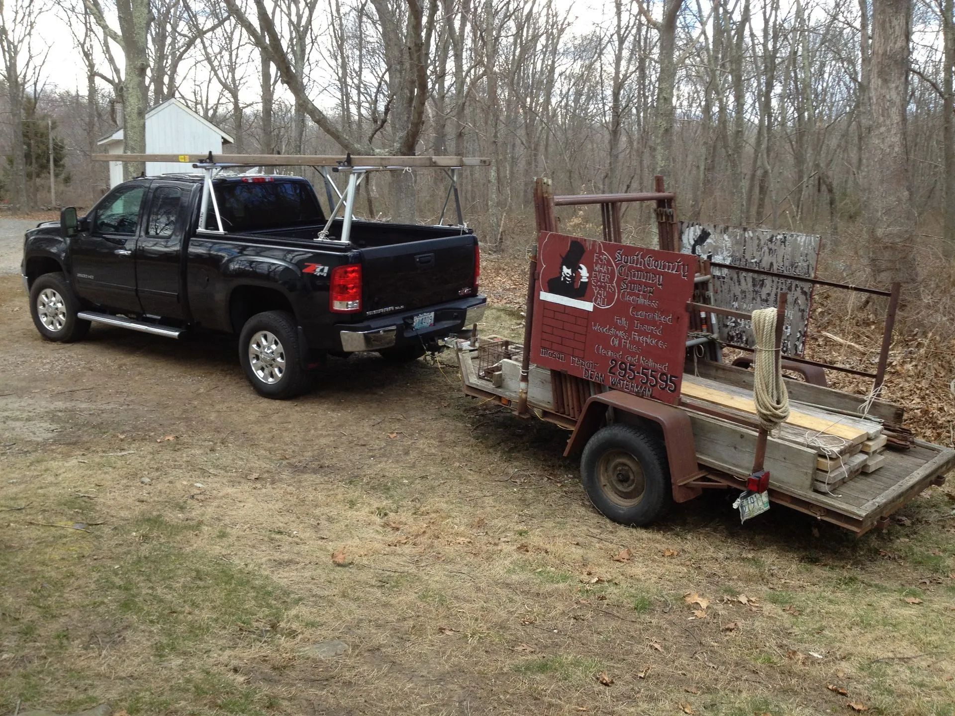 Two company vehicles parked next to each other.