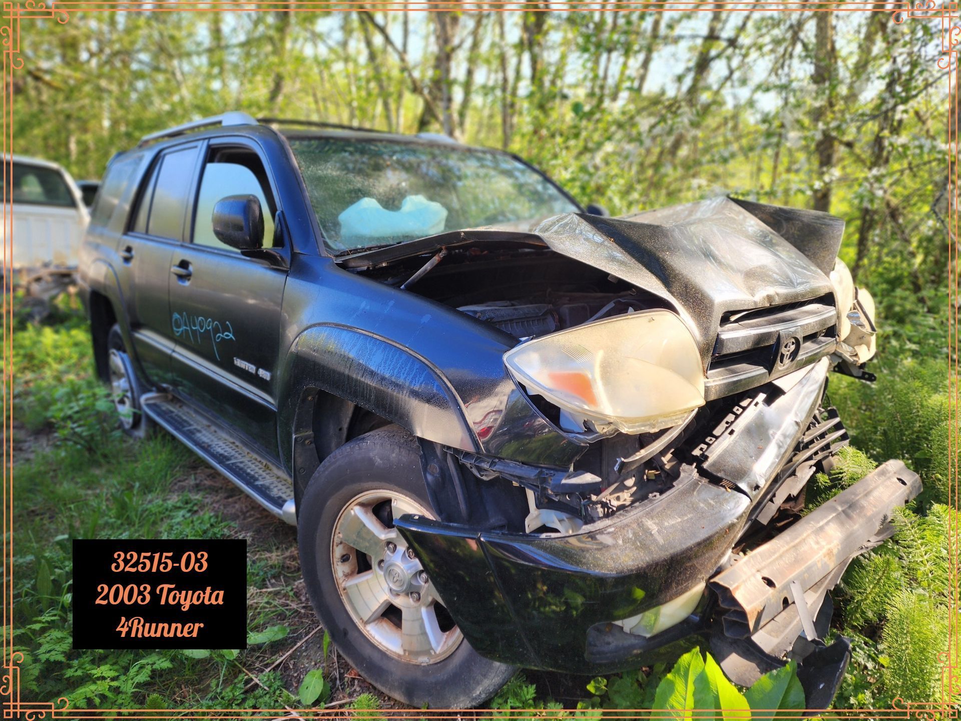 Damaged black 2003 Toyota 4Runner SUV after a crash; front end severely damaged.