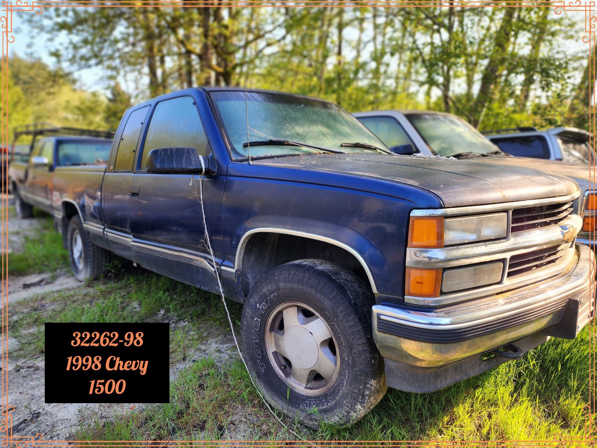 Blue 1998 Chevy 1500 truck parked outdoors.