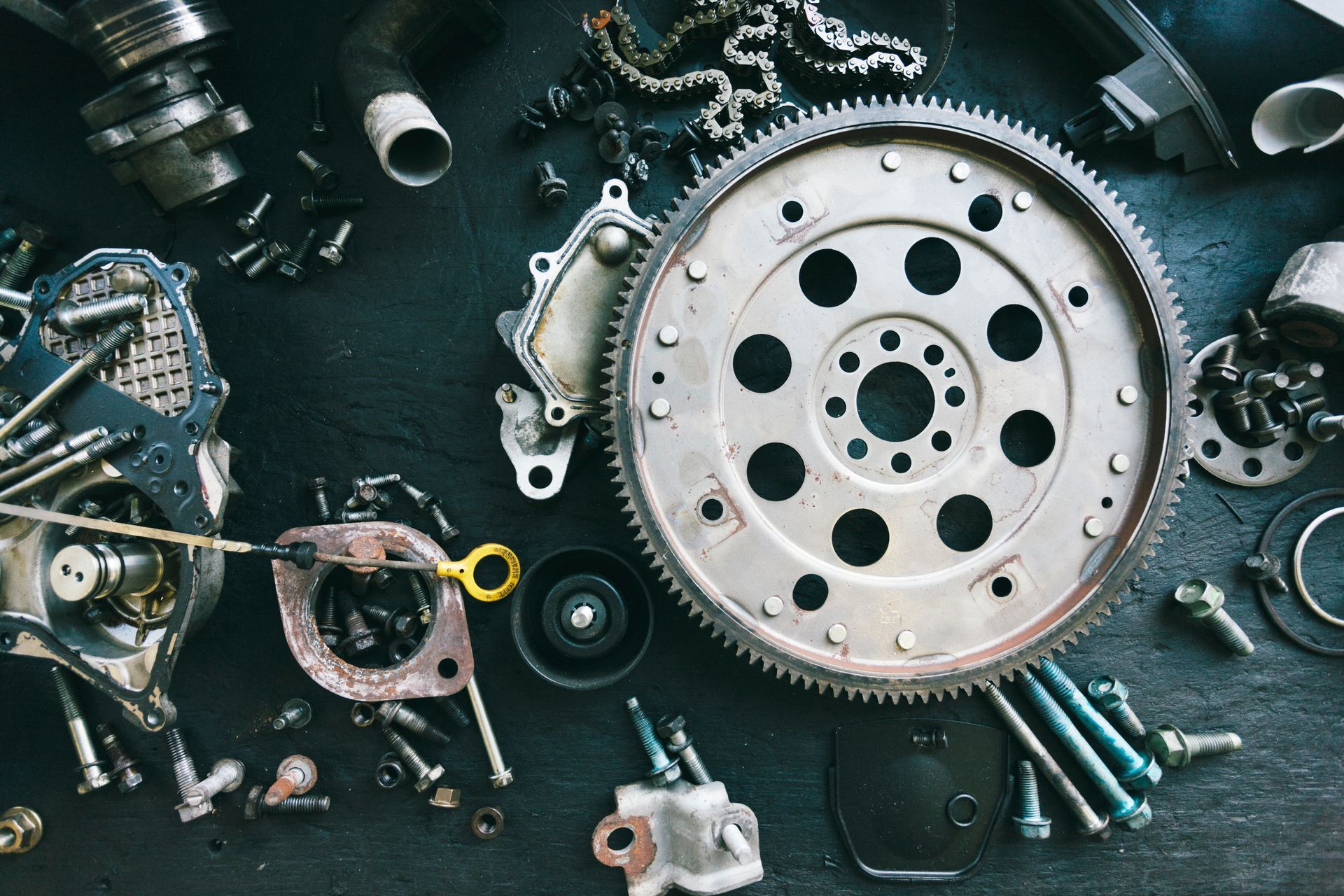 Car parts displayed on a workbench
