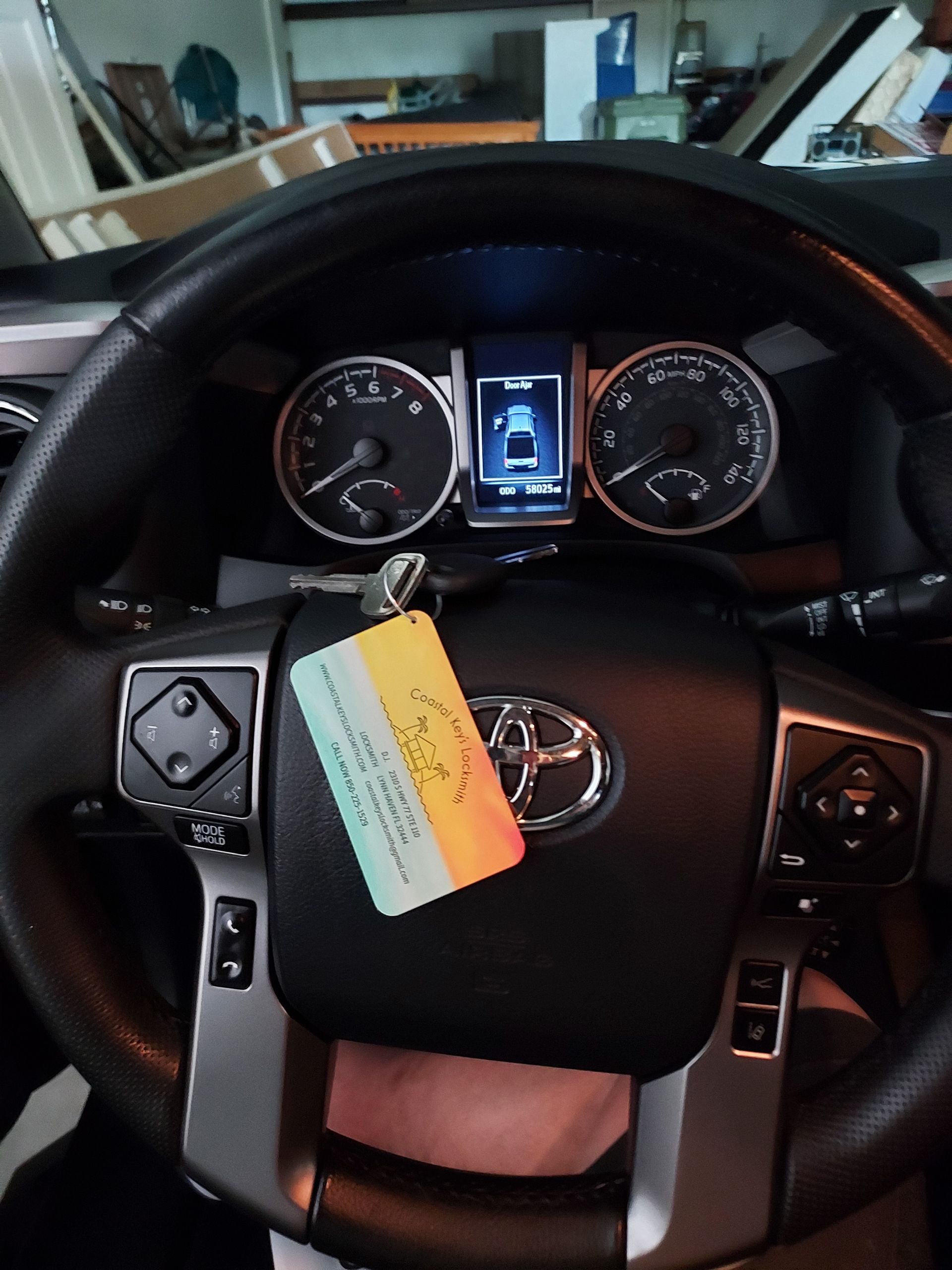A Man In A Black Shirt Is Opening The Door Of A Car - Lynn Haven, FL - Coastal Keys Locksmith A Man In A Black Shirt Is Opening The Door Of A Car - Lynn Haven, FL - Coastal Keys Locksmith