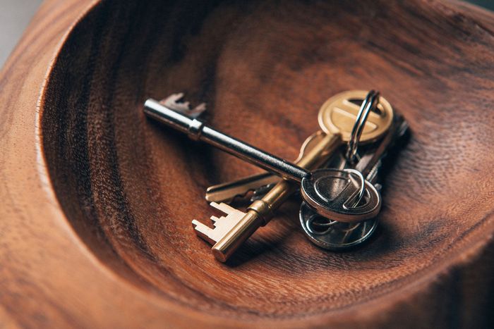 A Man In A Black Shirt Is Opening The Door Of A Car - Lynn Haven, FL - Coastal Keys Locksmith