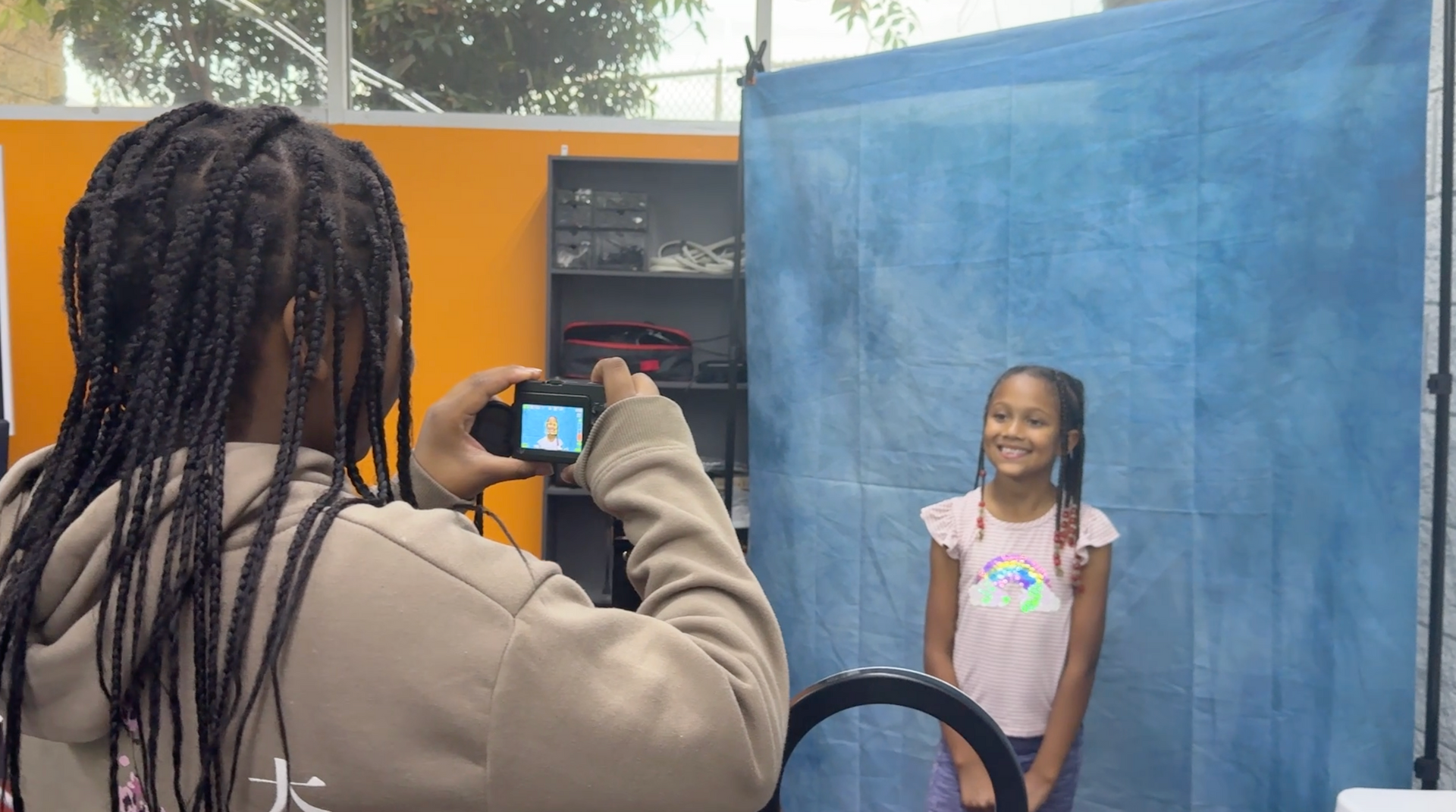 counselor and 3 children playing foosball