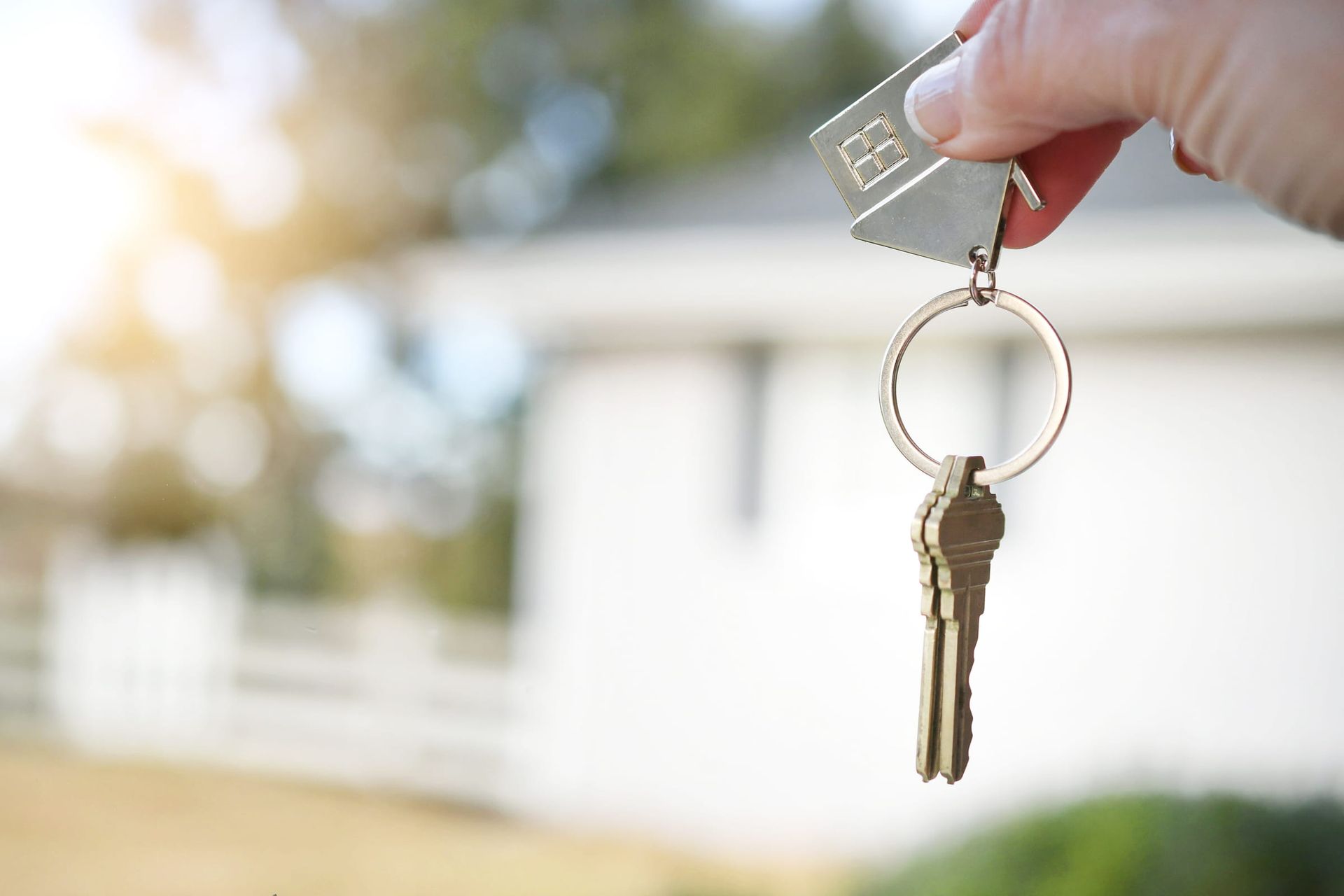 Two glasses of orange Aperol Spritz cocktails with fruit garnishes and straws, sitting on a wooden table.