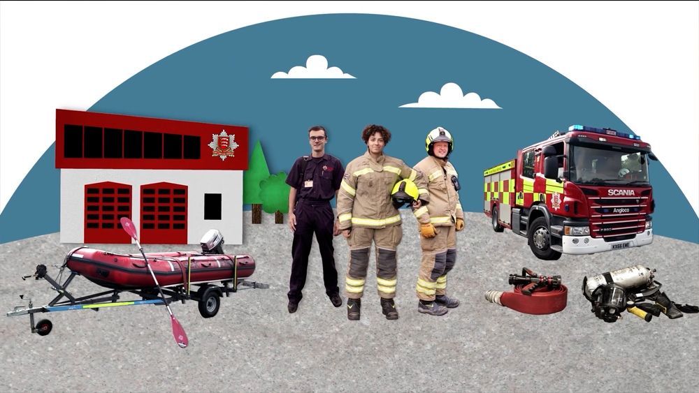 Firefighters stand near a fire station, rescue boat, and truck.