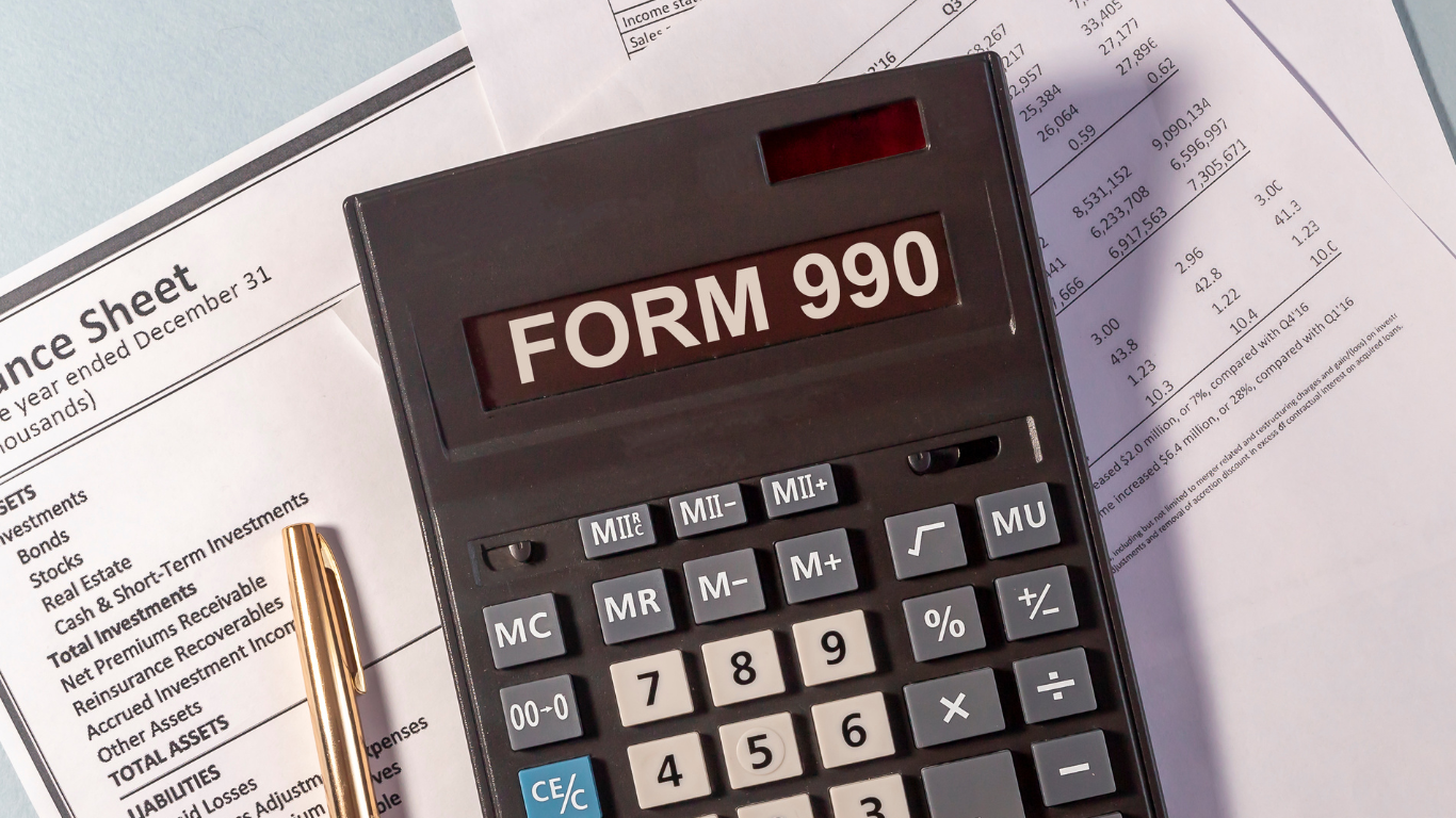 A calculator with the word form 990 on it