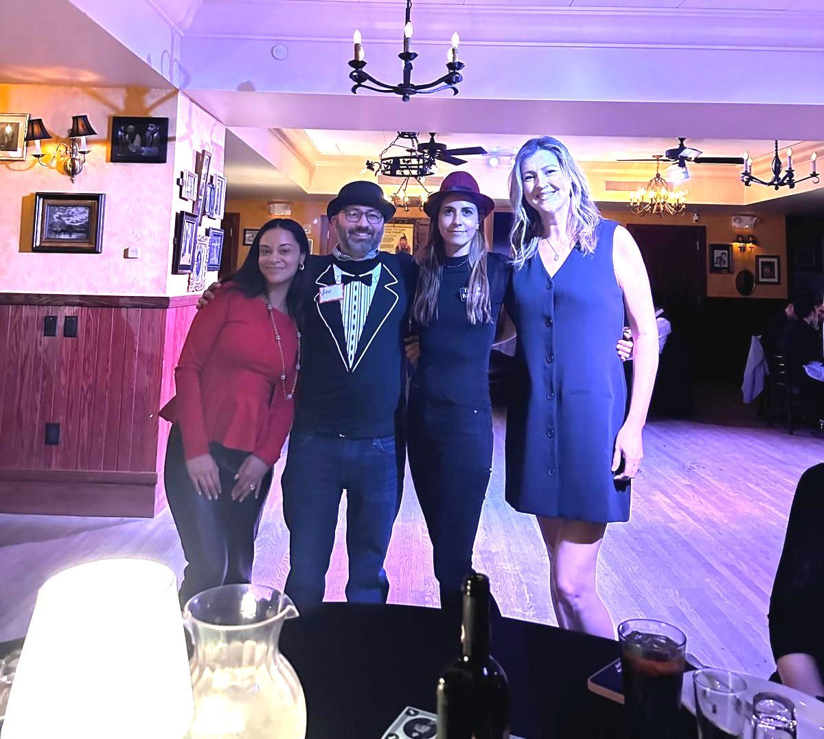 A group of people posing for a picture in a room