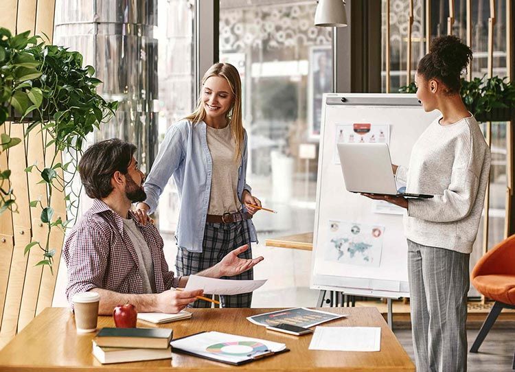 A group of people are having a meeting in an office.