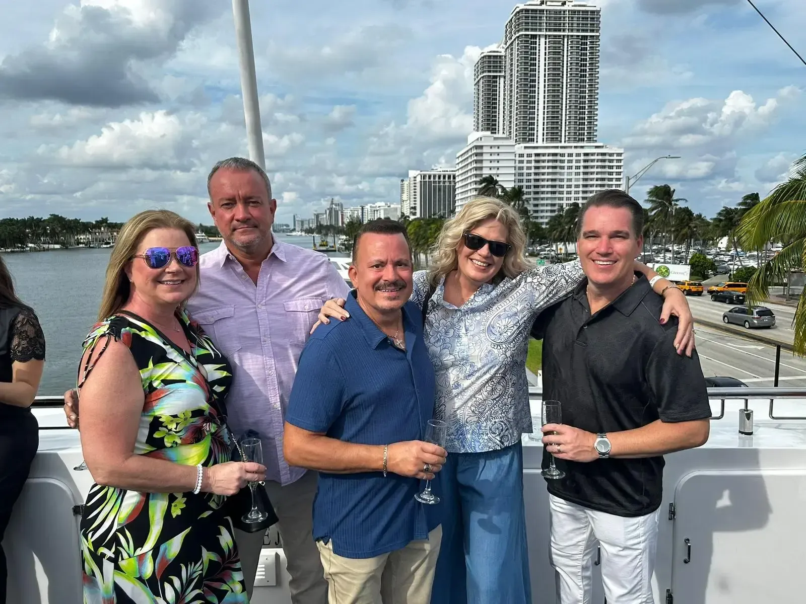 A group of people are posing for a picture on a boat.