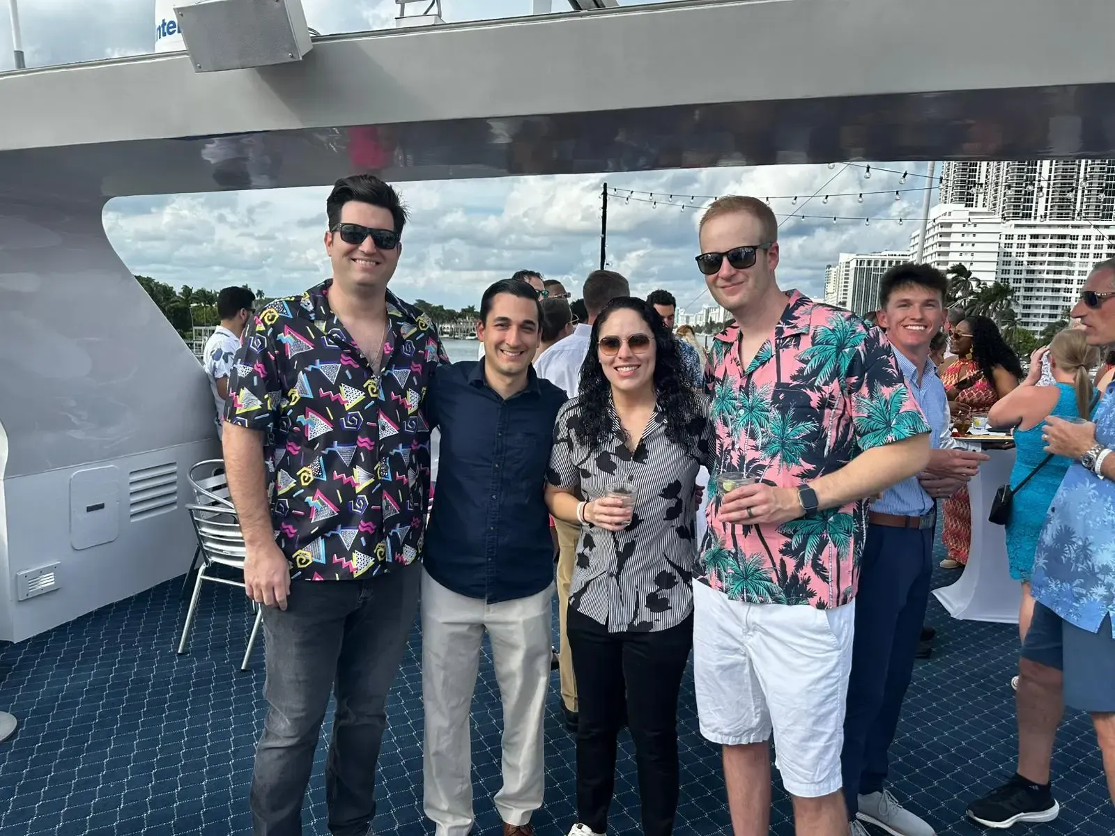 A group of people are posing for a picture on a boat.