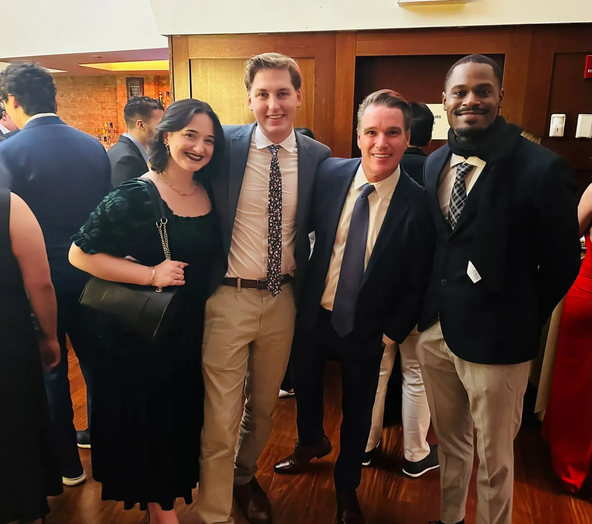 A group of people posing for a picture in a room