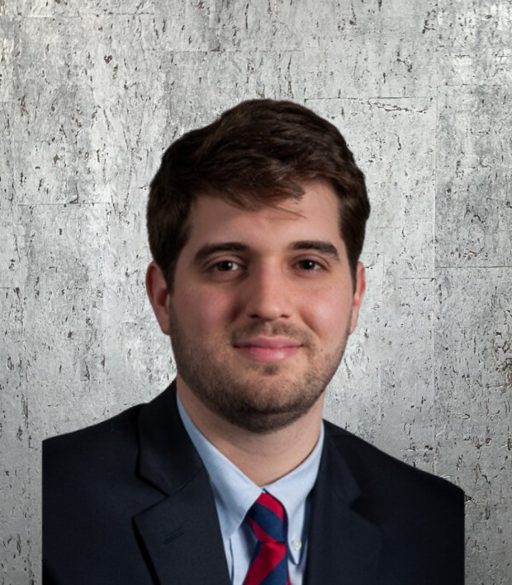 A man with a beard wearing a suit and tie