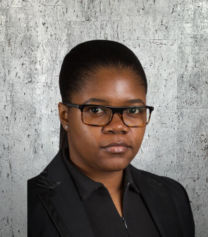 A woman wearing glasses and a black jacket