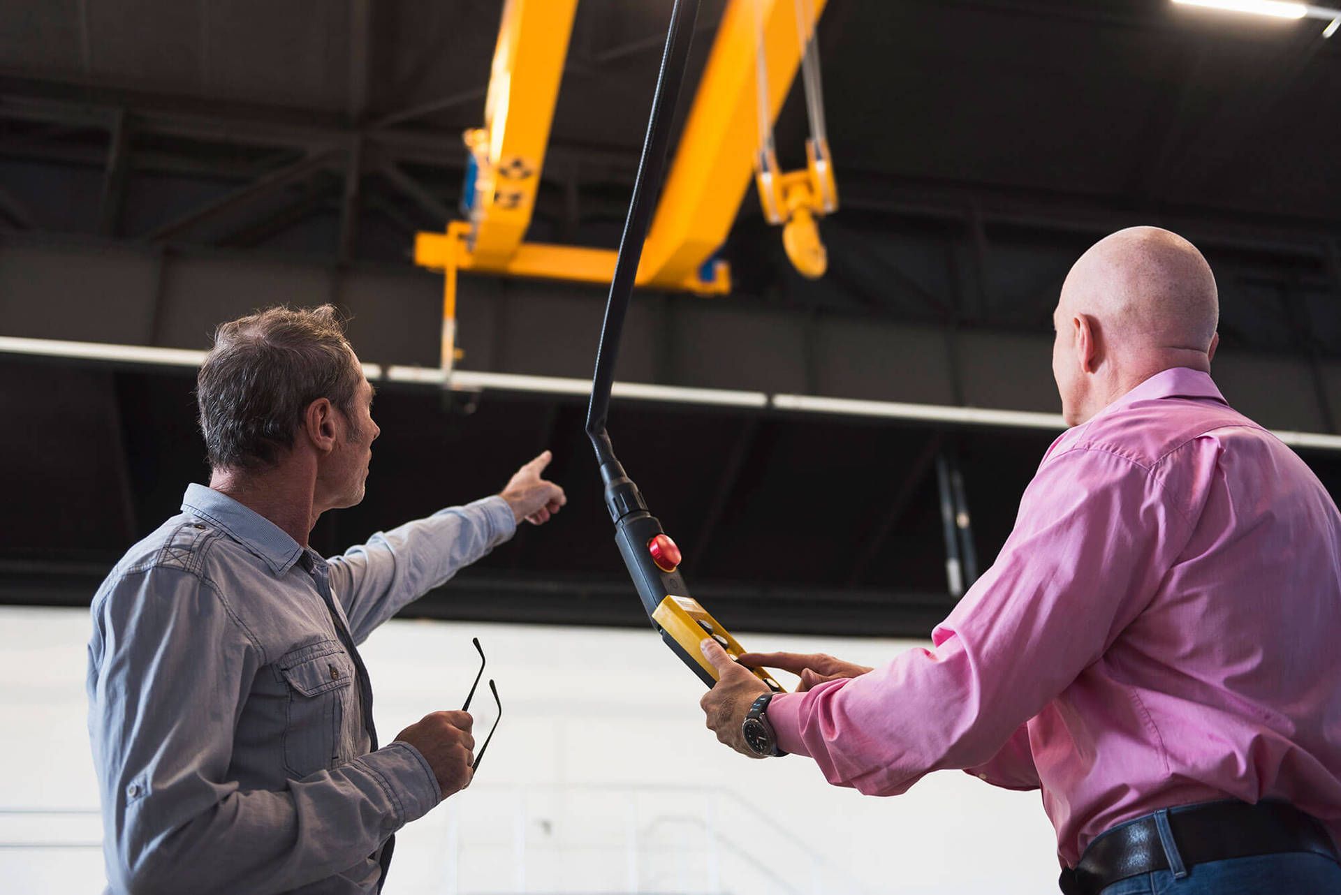 Two men testing a crane