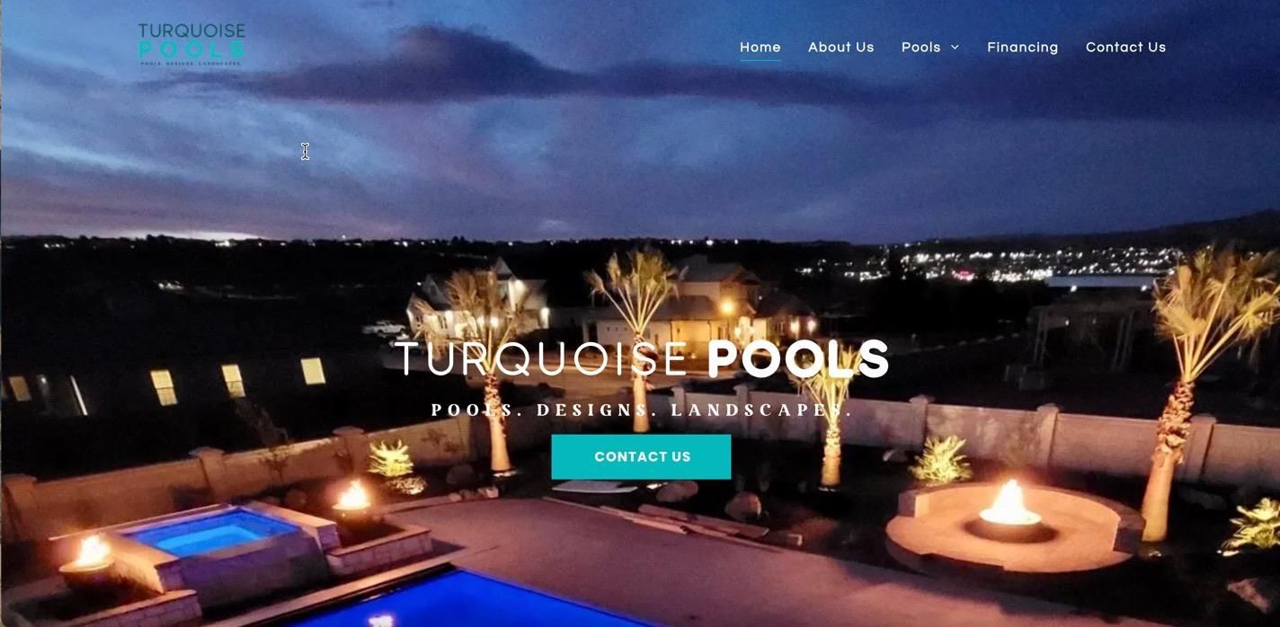 Night view of a pool with lit fire pit and landscape, the company Turquoise Pools.