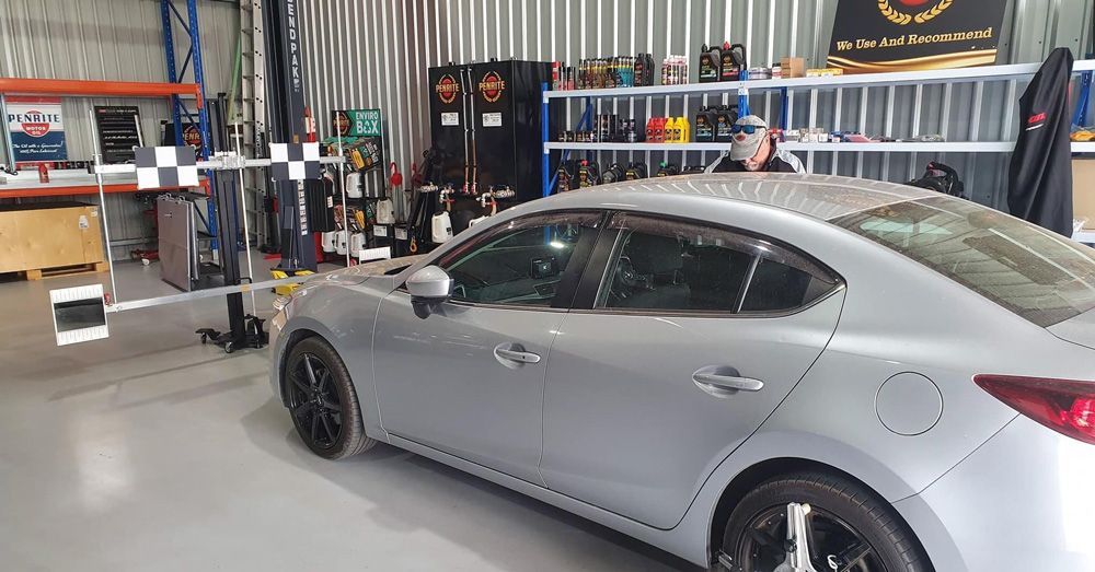 Car in Garage for Windshield Inspection