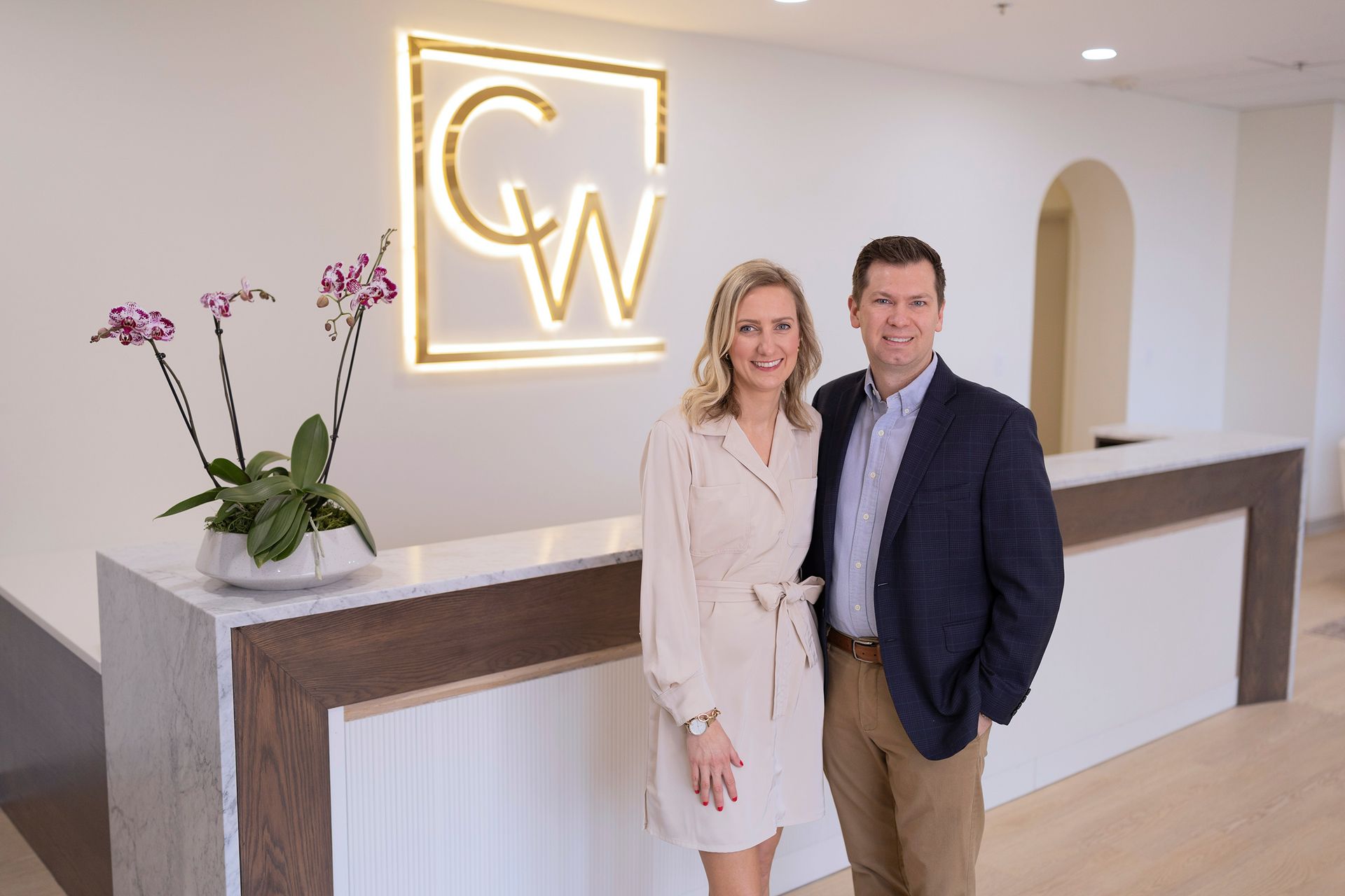 Dr. Carson Williams and his wife, Rachel at their facial plastic surgery office in Leawood KS