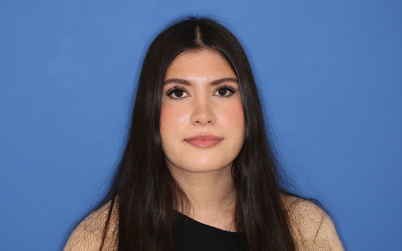 A close up of a woman 's face with a nose and lips.