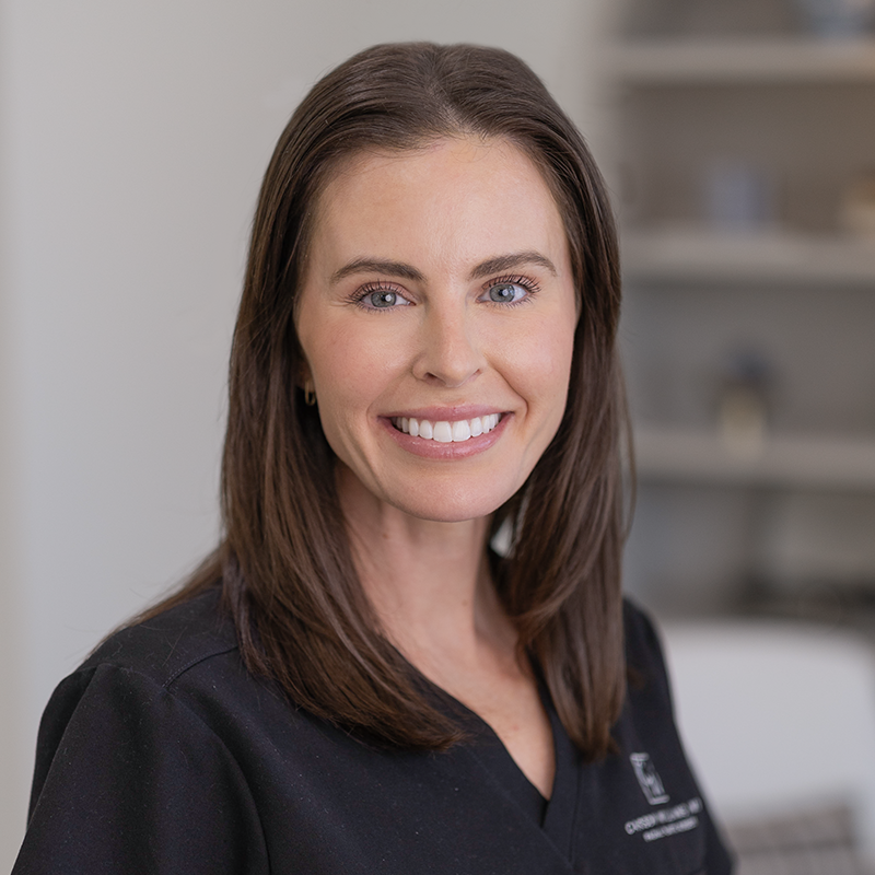 Image of four CWFPS staff members smiling at the camera at the Facial Plastic Surgery office in Leawood, KS.